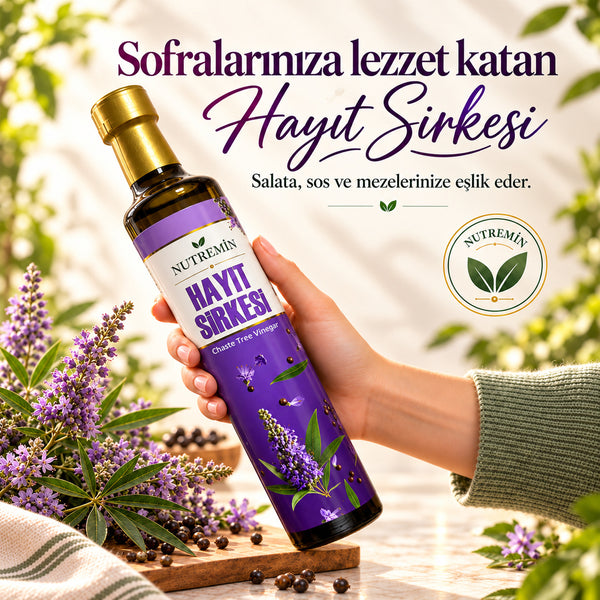 Nutremin Hayıt Sirkesi 500 ml, çiçeklerin yanında elde tutulan şişe ve tanıtım görseli.